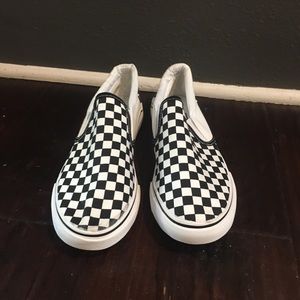 Black and white checkered slip ons